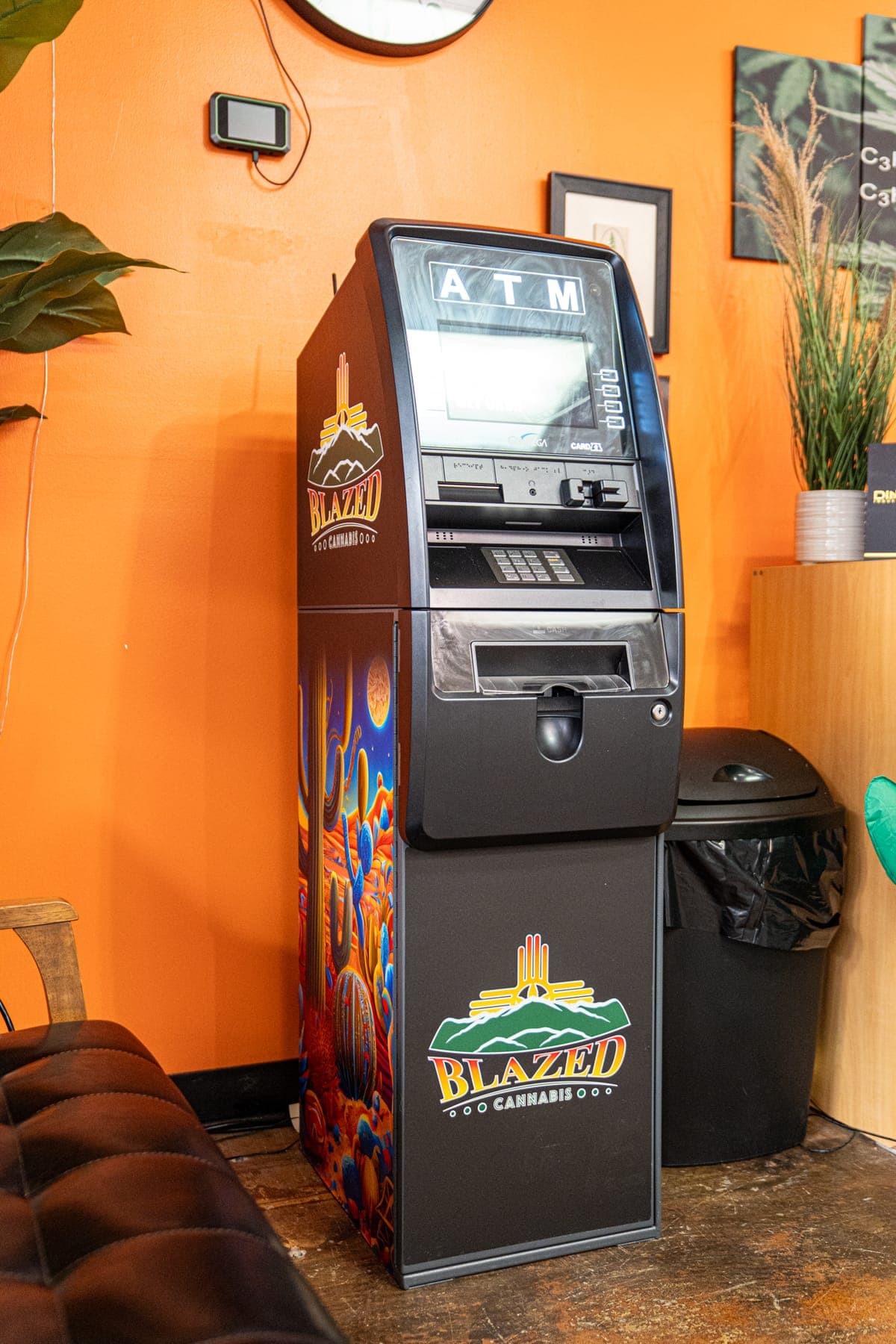 The ATM inside the shop, wrapped in the Blazed logo