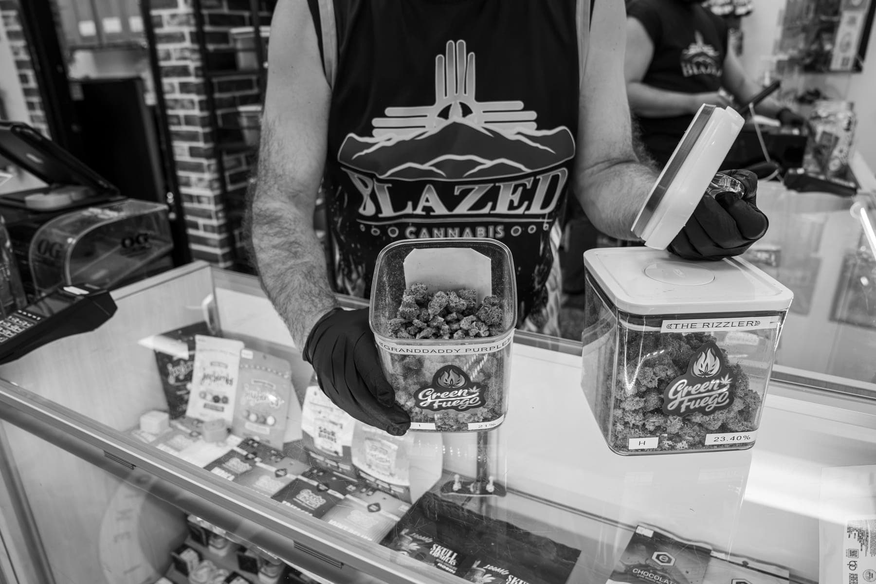 Black-and-white photo of a tub of flower held at the counter
