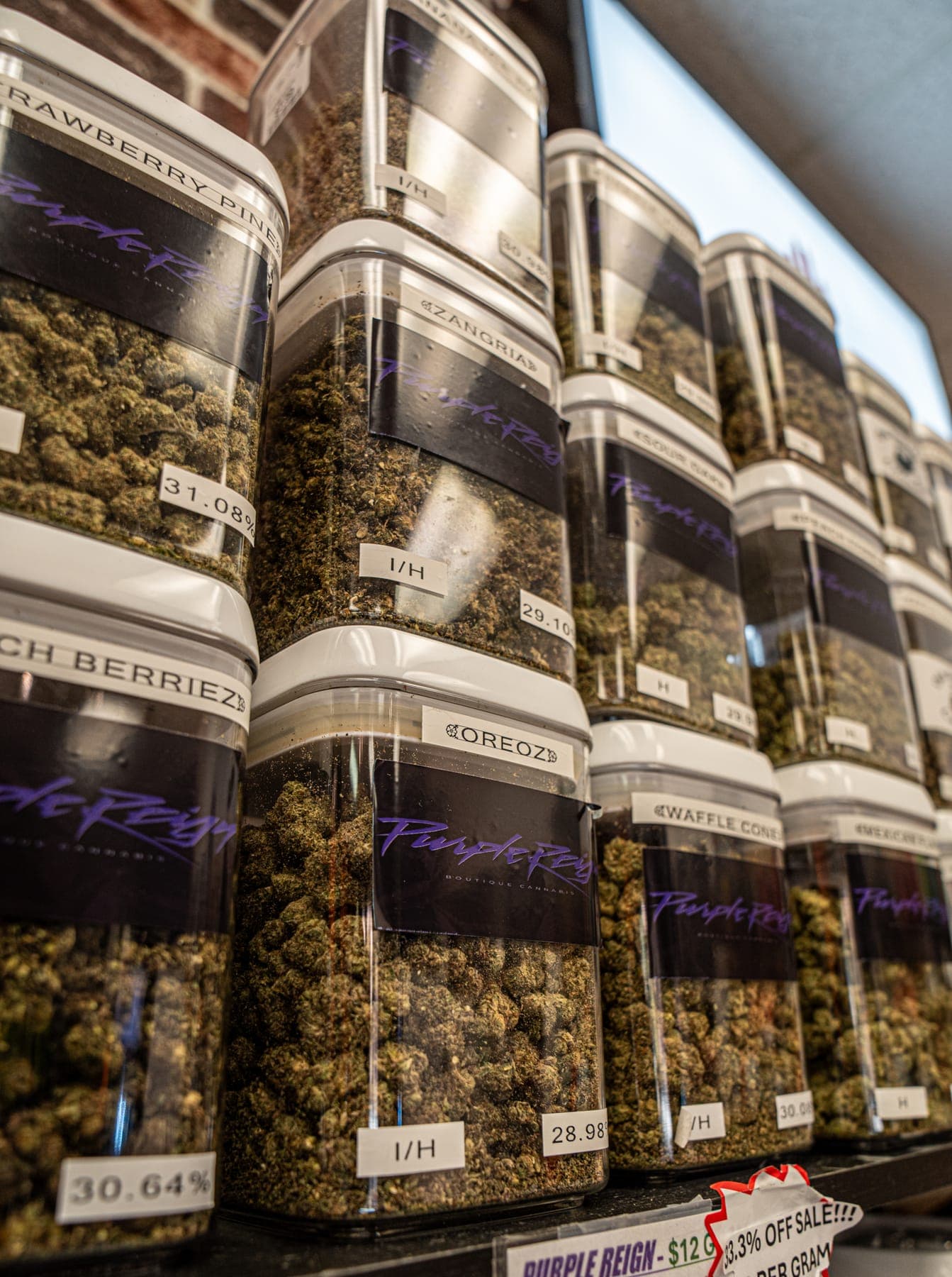 Labeled jars of flower stacked on the shelf