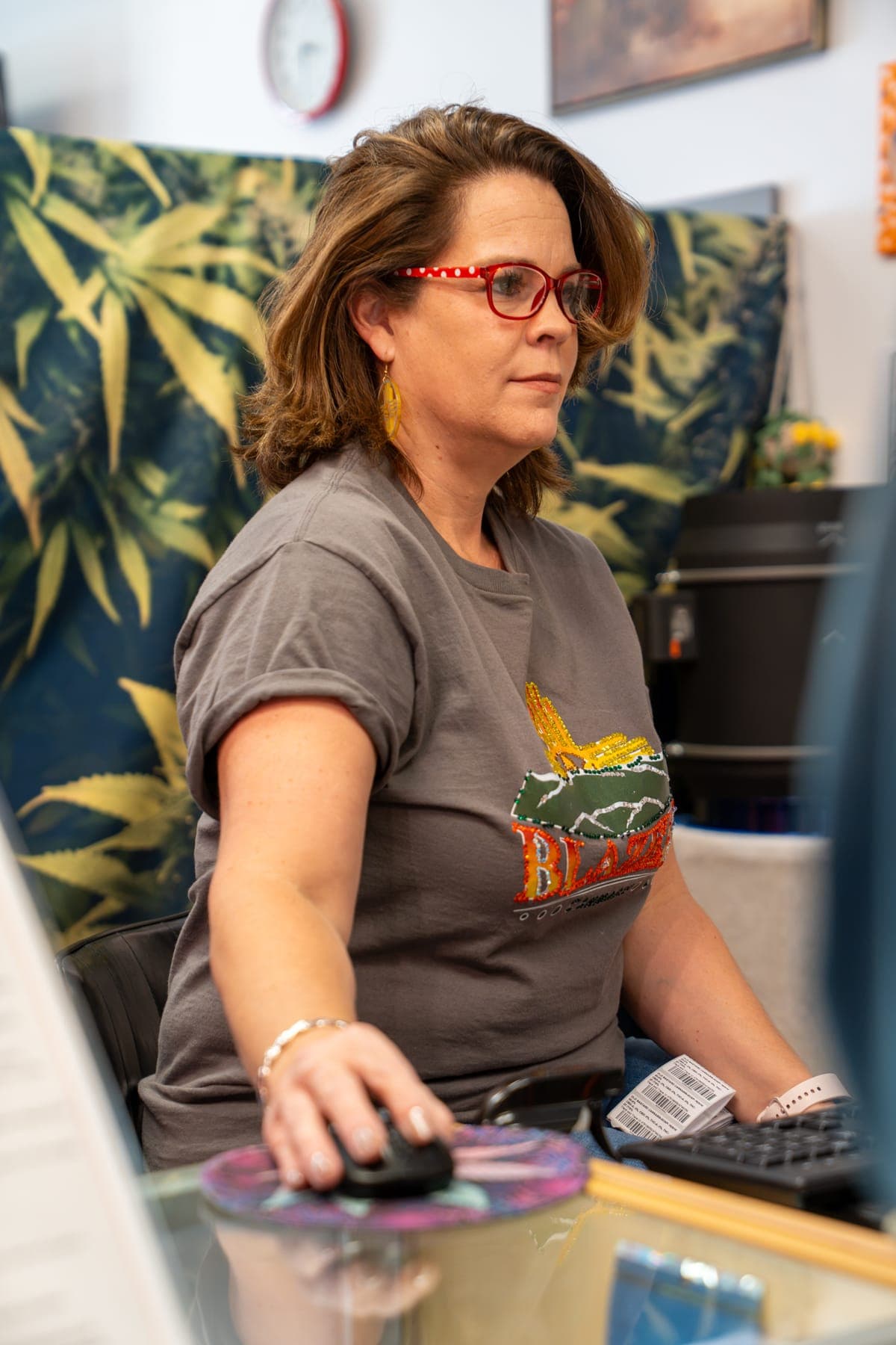 Jennifer at the computer in the back office