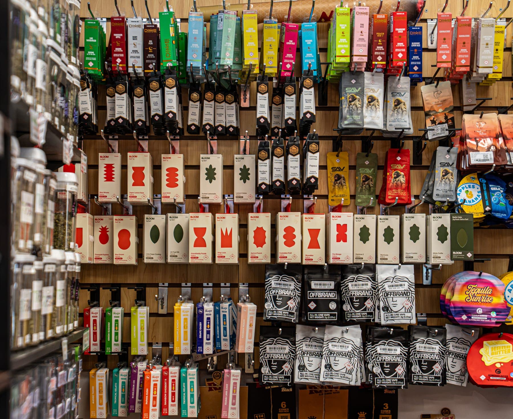 The wall of pre-roll packs hanging in rows