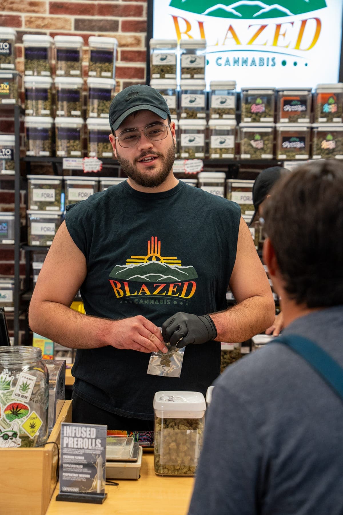 One of the sons helping a customer at the deli counter