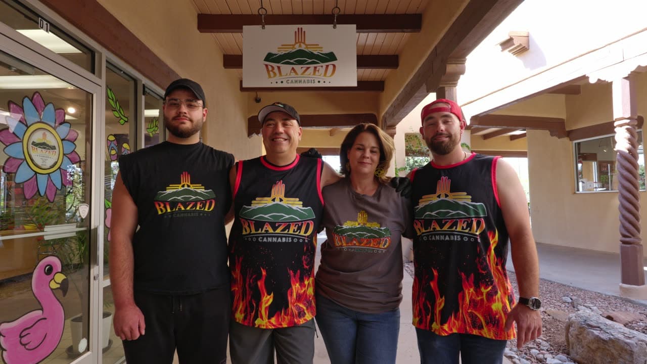 James, Jennifer, Dominic, and Anthony under the Blazed sign